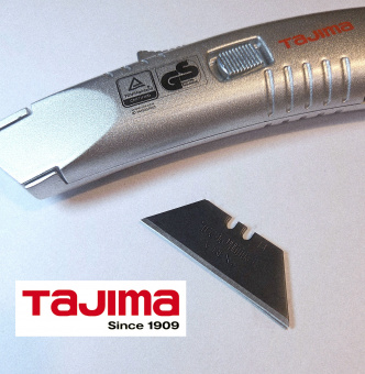 Нож монтажный TAJIMA V-REX (VR103D) с выдвижным трапезоидным лезвием (3 лезвия в комплекте), металл
